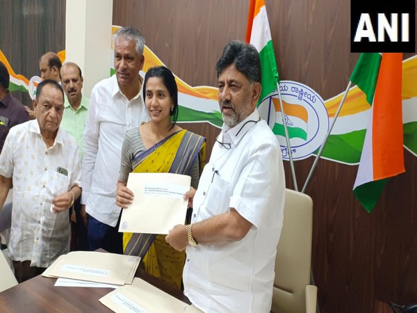 Karnataka Congress President DK Shivakumar distributes the 'B' form to the party candidates ahead of their filing nomination for assembly elections. (Photo/ANI)