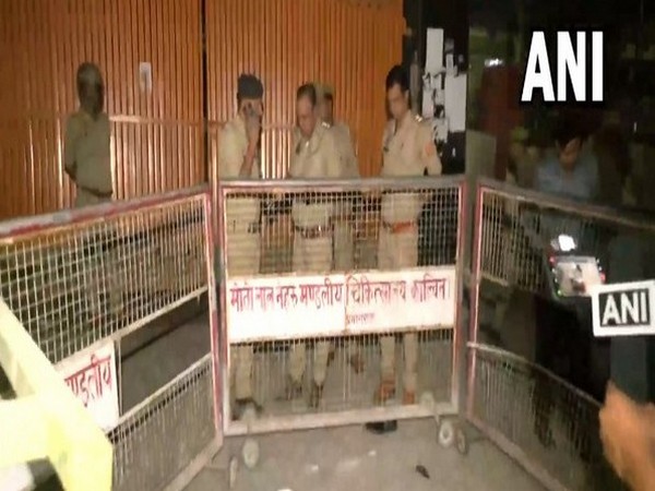 Police personnel at the scene after Atiq Ahmed and Ashraf were shot dead (Photo/ANI)