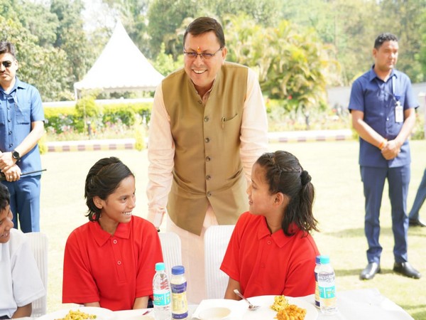 Uttarakhand Chief Minister Pushkar Singh Dhami meets children of Kedarpuram Shishu Sadan. (Photo/ANI)