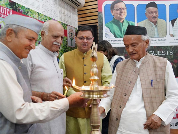 Uttarakhand Chief Minister Pushkar Singh Dhami (M), Former CM Bhagat Singh Koshyari (R) at a event in Dehradun