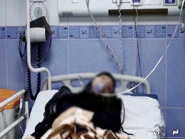 A young woman lies in hospital after reports of poisoning at an unspecified location in Iran. Screengrab of video from March 2, 2023. (File Photo/Reuters)
