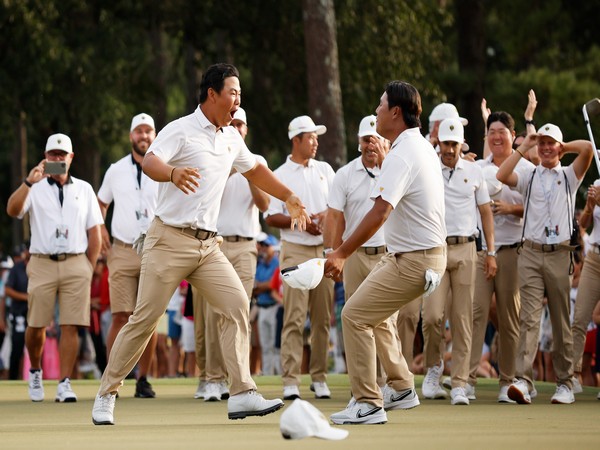 Korean golfers Si Woo Kim, Tom Kim celebrating after their win at Presidents Cup (Image: PGA)