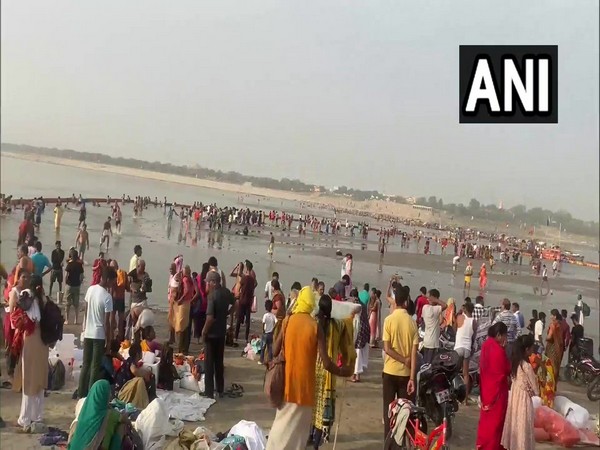 Devotees take holy dip at Sangam in UP's Prayagraj. (Photo/ANI)