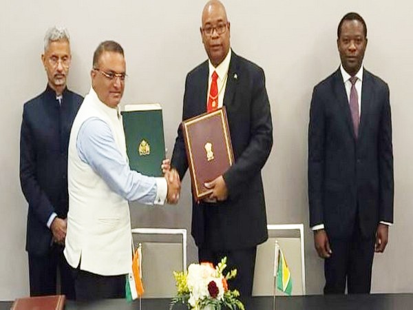  Guyana's Public Works Minister Juan Edghill (second right) and Indian High Commissioner to Guyana Dr. KJ Srinivasa (second left) after signing the agreement. (Photo: Ministry of Public Works)