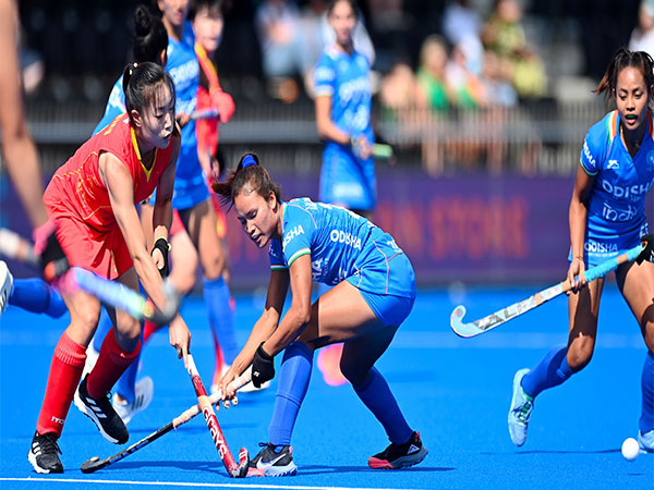 Indian women's team forward Lalremsiami in action against (in blue)  (Photo: HI Media)