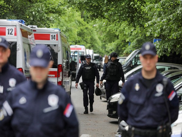 Police officers secure area after 14-year-old boy opened fire in Belgrade (Image Credit: Reuters)