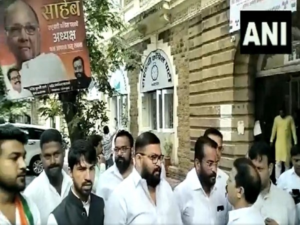 NCP party workers raise slogans in support of Sharad Pawar (Photo/ANI)