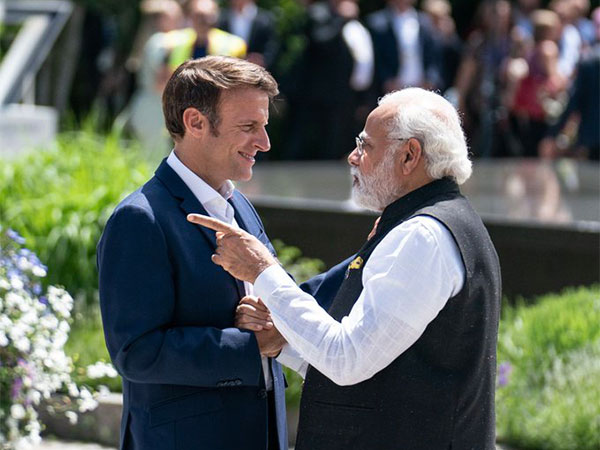 French President Emmanuel Macron with PM Modi. (Photo Credit - Twitter)