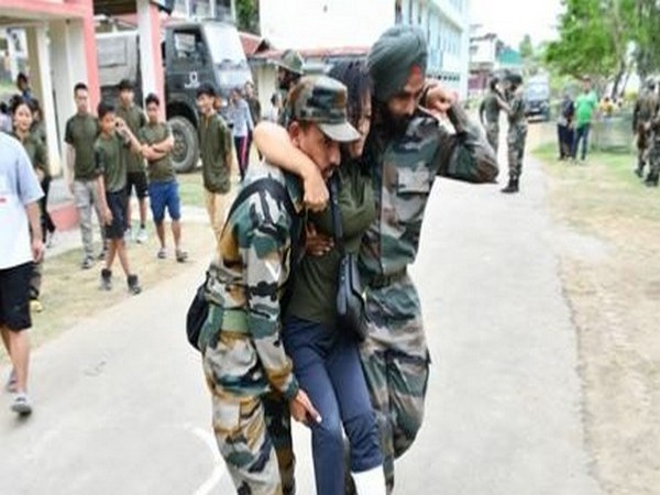 Indian Army jawans helping out a civilian in Manipur (Photo/Indian Army)