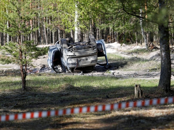 Damaged car overturned after Zakhar Prilepin injured in car explosion (Image Credit: Reuters)
