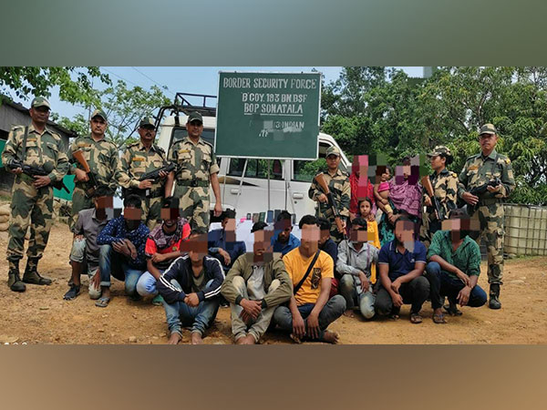 BSF officials with apprehended Bangladeshi nationals (Photo/ANI)