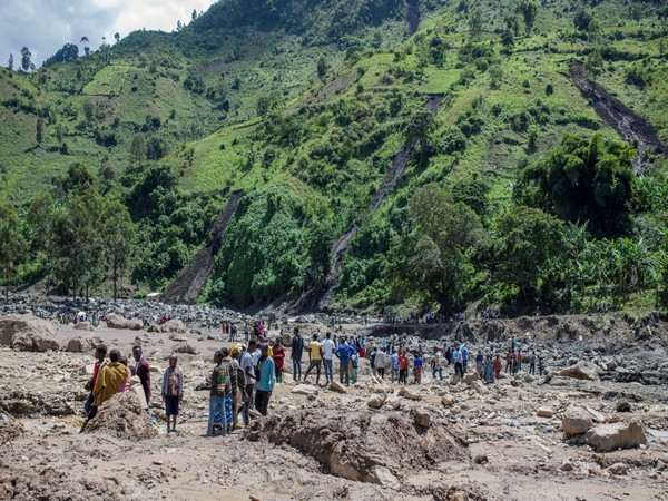 People gather after death of their family members after rains (Image Credit: Reuters)