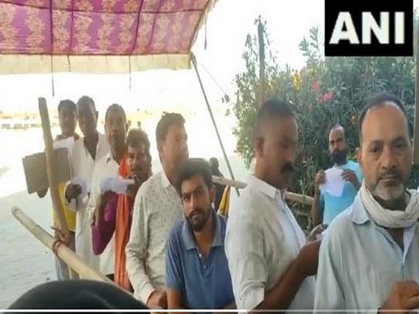 People line up to vote in bypoll to Suar Assembly seat in Uttar Pradesh (Photo/ANI)