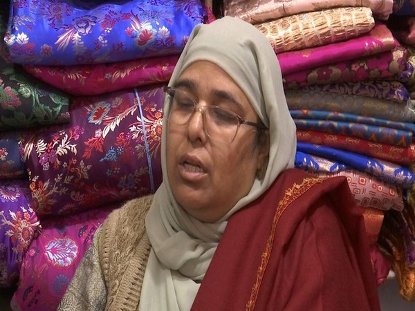 Srinagar resident Anjum Gulfam sells fabrics by the kilograms (Photo/ANI)
