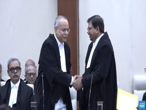 Justice Dharmesh Sharma (Right) (Photo Courtesy: National Informatics Centre)