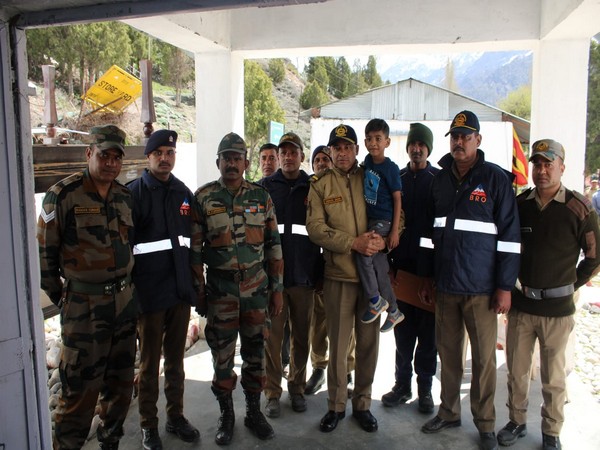 A child who was rescued posing with a team of Border Roads Organisation (Photo credit: BRO)