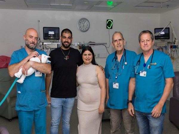 Parents Amir and Yuval Ganeh with their baby son and doctors at the Assusta Ashdod Public Hospital as the baby was released from the hospital on May 22, 2023.