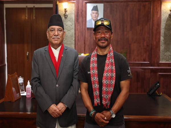 Hari Budha Magar (left) meets Nepal Prime Minister Pushpa Kamal Dahal. (Photo/ANI)