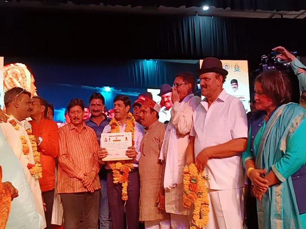 Indore Mayor distributing certificates to residents of the colonies (Photo/ANI)