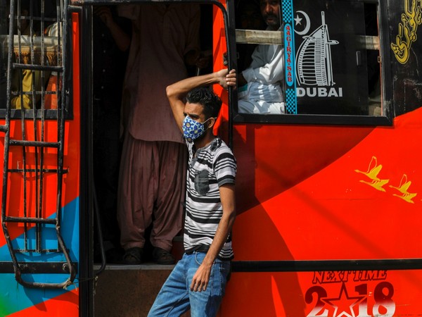 A Pakistani youth travelling is a pubic transport bus. (File Photo/Reuters)