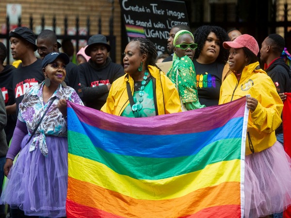 People hold placards during a demonstration against the proposed new Ugandan anti-gay legislation law. (Photo Credit: Reuters)
