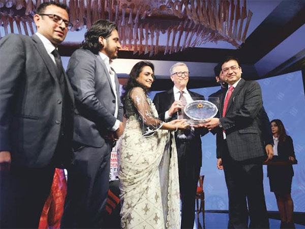 Pankaj Agarwal and Anshu Agarwal with Bill Gates