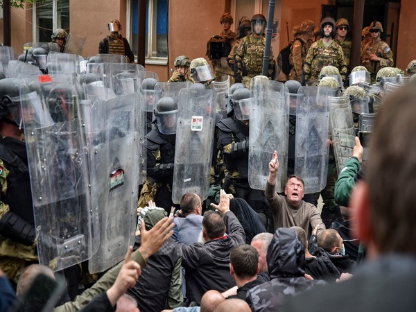 Kosovo Force (KFOR) soldiers clash with local Kosovo Serb protesters in the town of Zvecan. (Photo Credit: Reuters)