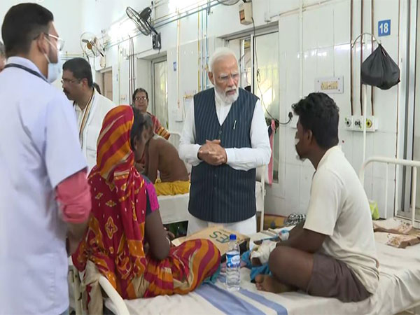 Prime Minister Narendra Modi meeting injured persons (Photo/ANI)