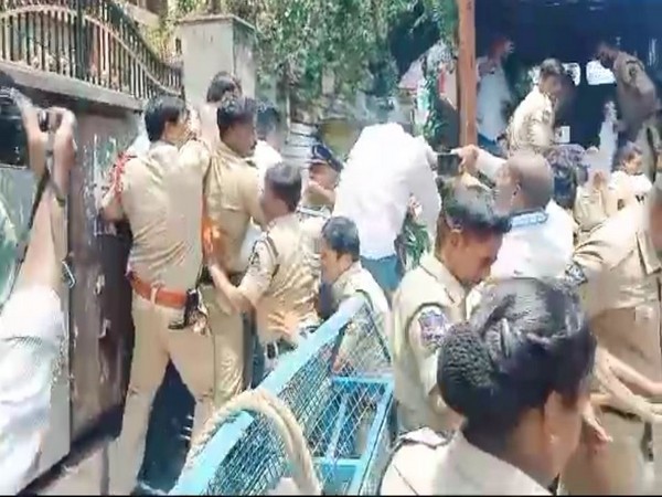 Police officials try to stop the protesters from entering the Telangana State Board of Intermediate Education campus on Wednesday