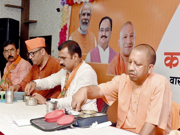 Uttar Pradesh Chief Minister Yogi Adityanath in the BJP's tiffin meeting in Varanasi on Sunday. (Photo/ANI)