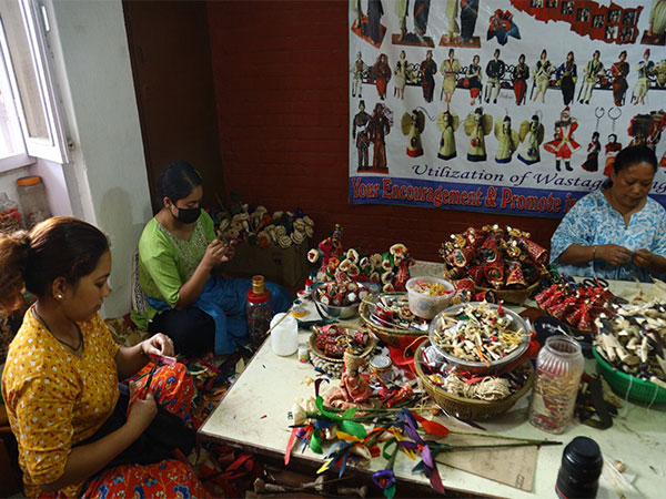 Laxmi Nakarmi (Right Corner) works at her workshop along with her employees at Patan of Lalitpur in Nepal