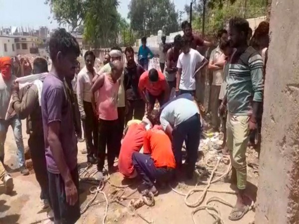 Sanitation workers being pulled out of sewer line in Gwalior. (Photo/ANI)