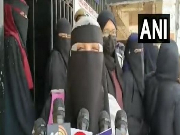 One of the girl students in burqa at the examination center (Photo/ANI)