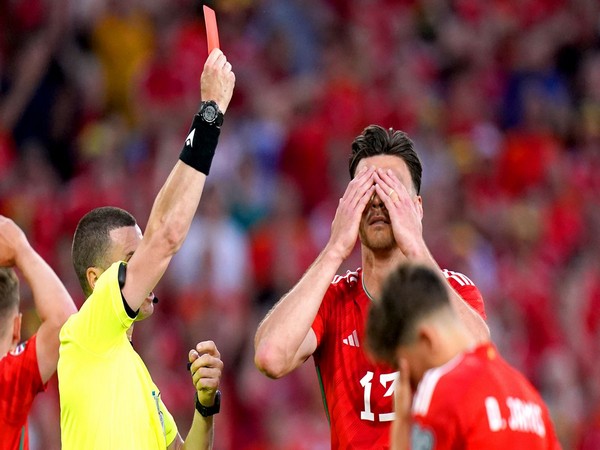 Kieffer Moore receiving red card during the match against Armenia (Source: UEFA)