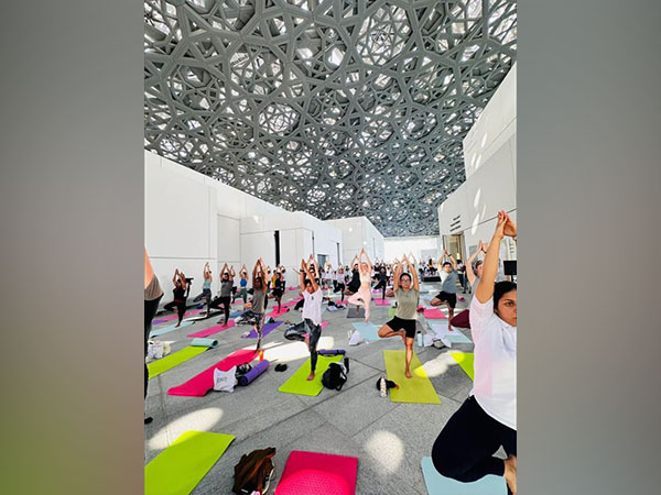 People performing Yoga during an event at the Louvre Museum, Abu Dhabi on Saturday (Photo/ANI)