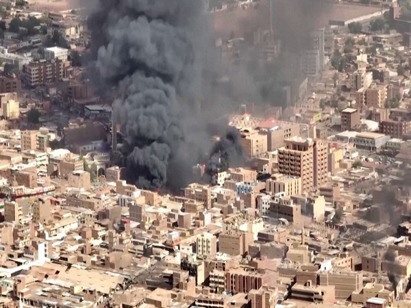 An aerial view of the black smoke and flames at a market in Omdurman (Image Credit: Reuters)