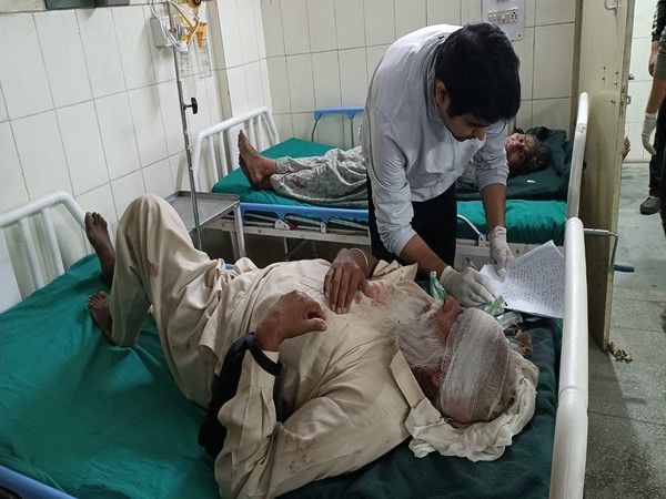 Injured getting treatment after bus overturned in Champawat (Photo/ANI)