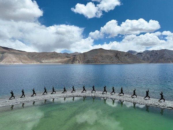 Indian Army personnel perform Yoga at Ladakh's Pangong Tso Lake. (ANI/photo)