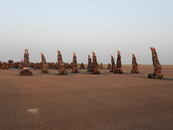 Indian Army personnel perform Yoga (Photo/ANI)
