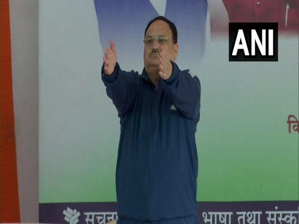 JP Nadda performs yoga on International Yoga Day at Tau Devi Lal Stadium in Gurugram. (ANI/photo)