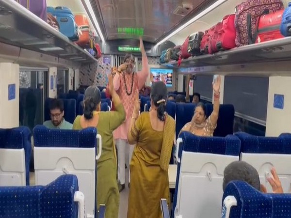 Passengers performing Yoga in train (Photo/ANI)