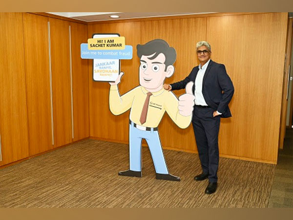 Dinanath Dubhashi, MD & CEO of L&T Finance Holdings Limited with fraud awareness mascot Sachet Kumar