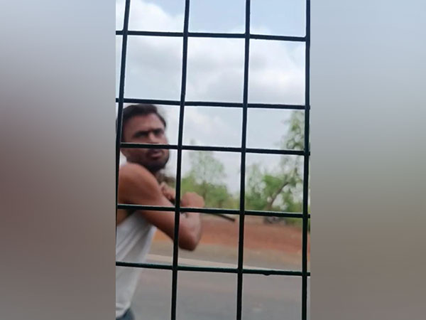 Man trying to attack on forest department team (snap from viral video)