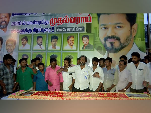 Fans cutting 50 Kg cake on Actor Vijay's 49th birthday (Photo/ANI)