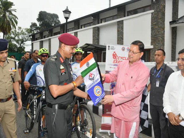 Uttarakhand CM Dhami flags off MTB Cycling Expedition team of NIM (Photo/ANI)