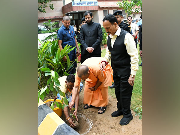 CM Yogi Adityanath plants saplings on University Guest House premises( Photo/ANI)