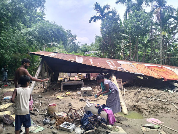 Assam: Locals take shelter on embankments (Photo/ANI)