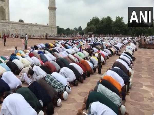 People offer namaz at the Taj Mahal in Agra on the occasion of Eid Al-Adha on Thursday. (Photo/ANI)