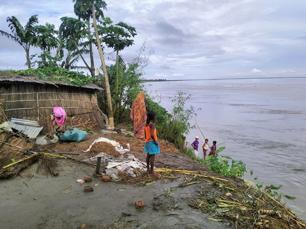 Villagers on the bank of Brahmaputra river (Photo/ANI)