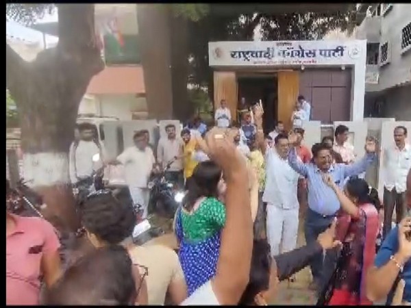 NCP workers celebrating outside party office in Jalgaon. (Photo/ANI)